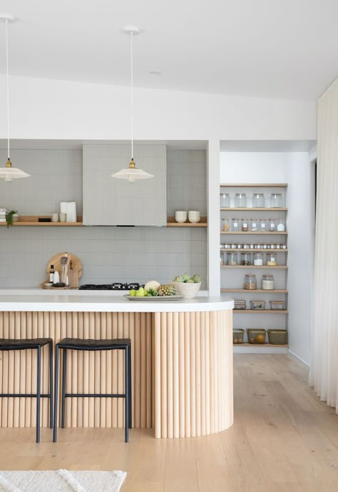 Modern kitchen design. Kitchen inspiration featuring curved island bench with timber panels, open pantry shelving. Kitchen styling. Porta Timber Kitchen, Ribbed Kitchen Island, Porta Timber, Curved Island, Curved Kitchen Island, Curved Kitchen, Kitchen Island Bench, Beach House Kitchen, Beach House Kitchens