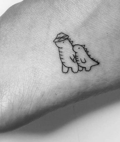 Dinosaur Tattoo For Couples, Rawr Tattoo Cute, Matching Dinosaur Tattoos Couples, Couples Dinosaur Tattoos, Pokemon Bulbasaur Tattoo, Dinosaur Couple Tattoo, Dinosaur Finger Tattoo, Cute Dinosaur Tattoos For Women, Dinosaur With Cowboy Hat Tattoo