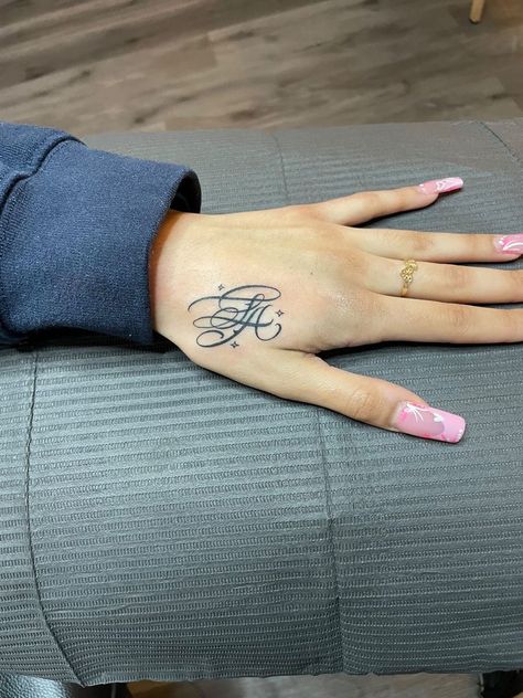 777 Hand Tattoo Name For Women, Letter Initial Tattoo Placement, Hand Tattoo Baddie, Thumb Tattoos Side Words, Where To Put Name Tattoos, K Hand Tattoo, La Hand Tattoo, Initial Tattoo Hand, Hand Initial Tattoo