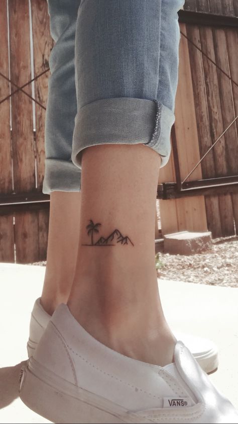 Mountain Palm Tree Tattoo, Mountain Finger Tattoo Simple, Ankle Mountain Tattoos For Women, Mountains Ocean Tattoo, Hawaiian Mountain Tattoo, Mountain And Palm Tree Tattoo, Hawaii Mountain Tattoo, Mountain To Sea Tattoo, Mountain Tattoo Ankle