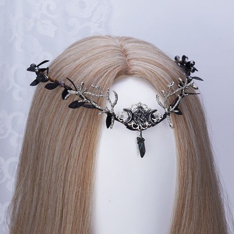 👑 Product Description:  -- Appearance: Moon Star Goddess Series - Black -- Adjustable size: The size can be adjusted with ribbon, one size fits most people, ideal for children and adults.  -- Comfortable to wear: Floral hair garland is convenient and comfortable to wear, and will not pull out hair when removed. -- Widely available: This Tiara is perfect for party, cosplay, wedding, stage productions, renaissance, christmas, birthday or other special occasions.  -- You can give it as a gift or c Cowboy Hat Crafts, Woodland Tiara, Elf Tiara, Tiara Black, Elf Crown, Elven Crown, Cool Hair Designs, Hip Jewelry, Black Tiara