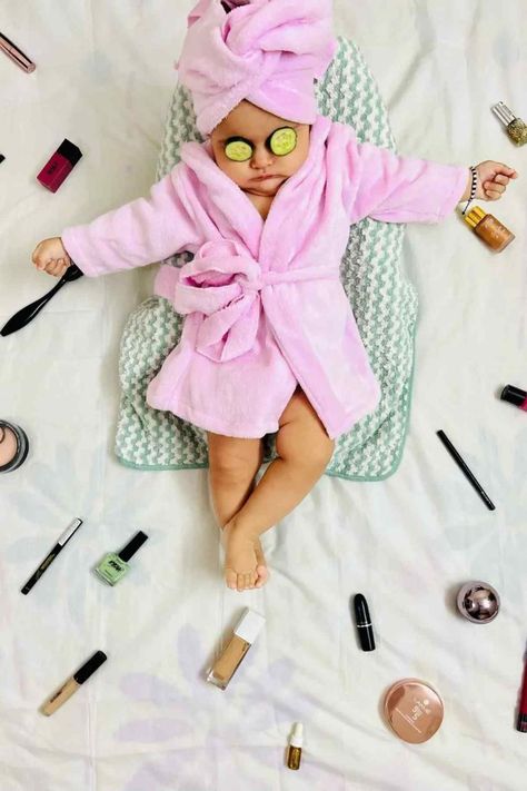 Baby in a pink bathrobe and head wrap with cucumber slices on eyes, surrounded by cosmetics and nail polish bottles. June Baby Photoshoot, Baby Summer Photoshoot, Baby Theme Photoshoot, Summer Baby Photoshoot, Pictorial Ideas, Pink Bathrobe, Summer Photoshoot Ideas, Baby Photoshoot Ideas, August Baby