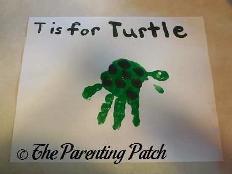 Make a letter T turtle craft with handprints and fingerprints using nontoxic paint. Turtle Handprint, T Is For Turtle, Letter T Crafts, Turtle Activities, Abc Crafts, Turtle Crafts, T Craft, Footprint Crafts, Toddler Art Projects