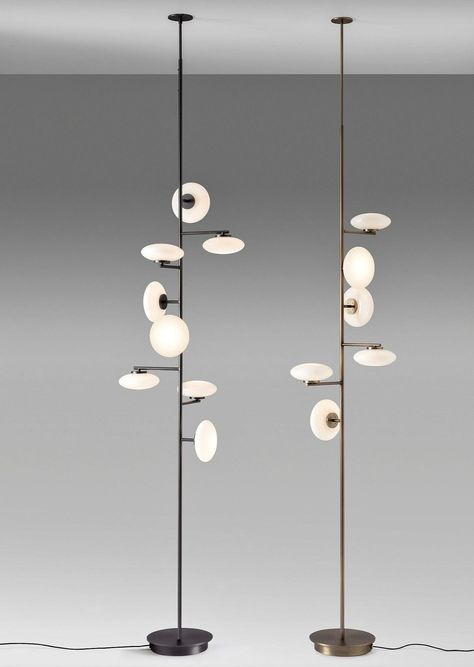 The Mamì floor ceiling lamp by Penta Light is a versatile and elegant, halfway between design and art. The white oval blown-glass body is reinterpreted with a modernist look in the suspension compositions, while remaining linear in the floor and table. Designed by Umberto Asnago, 100% made in Italy. Available in: Structure colour Matt Black or Brushed Bronze. Technical information: Dimensions: extra small: Ø32 x W50 (height min 220 cm - max 250 cm) small: Ø32 x W50 (height min 250 cm - max 280 c Custom Interior Doors, Large Floor Lamp, Bronze Lighting, Floor Ceiling, Contemporary Floor Lamps, Contemporary Lamps, Floor Lamp Design, Brushed Bronze, Interior Deco