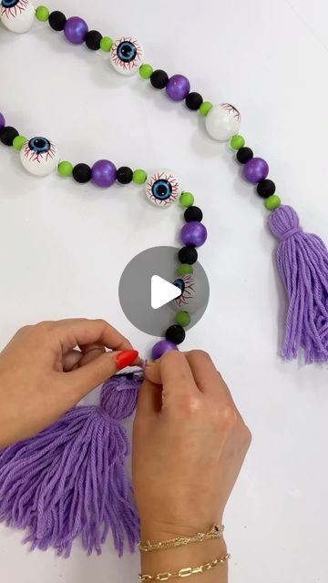 Perla Martinez on Instagram: "Turn the Dollar Tree Halloween eyeballs into a beaded garland! TIP: Use the tip of your hot glue gun to create the bead holes to easily feed the twine into it 💜  Supplies ✂️ - Plastic Eyeballs @dollartree  - Wood Beads  - Acrylic Paint  - Twine  - Hot Glue Gun @surebonder  • • #dollartreefinds #dollartree #dollartreecrafts #dollartreediy #dollartreecommunity #dollartreeobsessed #diyprojects #diycrafts #homedecor #diydecor #halloweendecor #halloweendiy #halloween #crafts #manualidad #diy #diyholic" Halloween Hot Glue Crafts, Dollar Tree Halloween, Halloween Eyeballs, Dollar Tree Finds, Diy Garland, Glue Crafts, Dollar Tree Crafts, Crafty Craft, Glue Gun