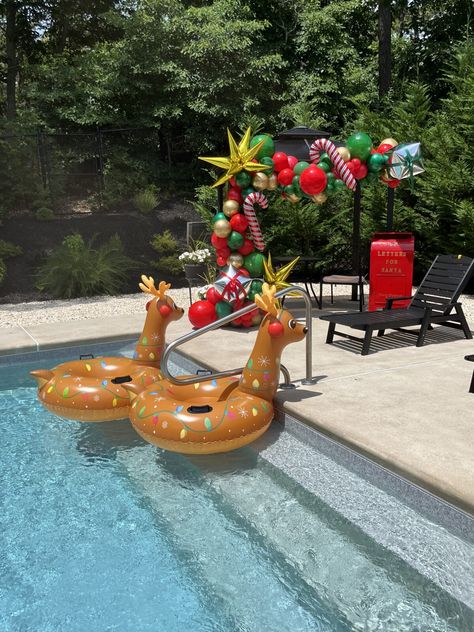 Christmas In July Party Theme | cupcakesandconfetti.com Luau Christmas Party Decorations, Christmas In July Pool Party Ideas, Xmas In July Party Ideas, Christmas In July Decor, Christmas In July Pool Party, Christmas In July Birthday Party, Christmas Pool Party, Tropical Christmas Party, Luau Christmas