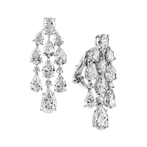 Befitting the ""King of Diamonds,"" Harry Winston’s Diamond Chandelier Earrings present a show stopping display of pear-shaped and round brilliant diamonds that sparkle with unparalleled brilliance and perfectly accentuate the beauty of its wearer. 20 pear-shaped and 6 round brilliant diamonds weighing a total of approximately 9.21 carats, set in platinum. Harry Winston Diamond Earrings, King Of Diamonds, Harry Winston Jewelry, Fine Jewelry Design, Harry Winston Diamond, Rare Diamond, Diamond Chandelier Earrings, Diamond Chandelier, Harry Winston