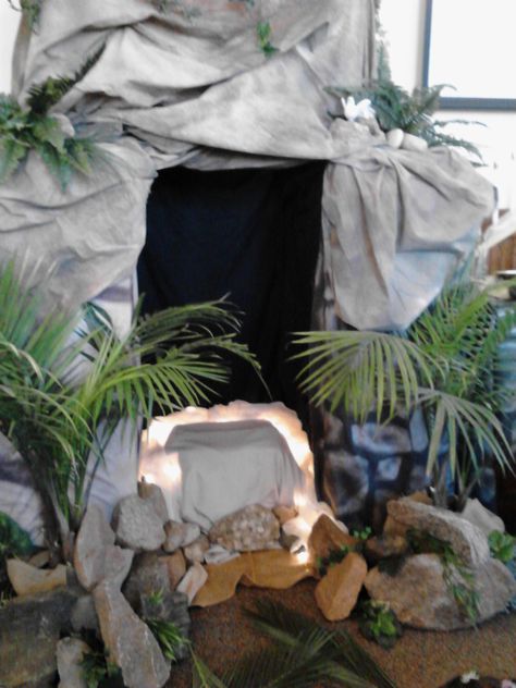 The Tomb was made from stacked cardboard boxes and we draped and tacked the cloth around to make it look like rock.  Put a light inside the tomb where Jesus would've laid. Easter Tomb, Sanctuary Decor, Jesus Tomb, Easter Play, Church Easter Decorations, Resurrection Day, Easter Event, Resurrection Sunday, Church Stage Design