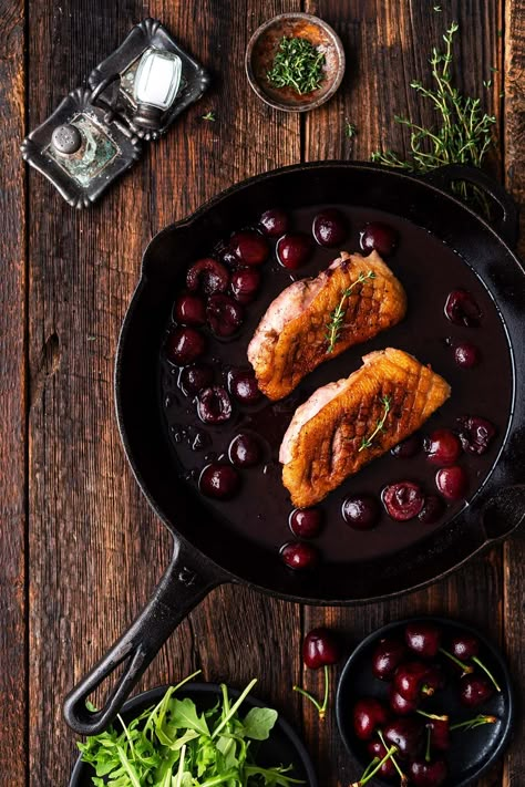 crispy pan seared duck breast recipe with cherry sauce in cast iron skillet Duck Breast With Cherry Sauce, Pan Seared Duck Breast, Roast Duck Breast, Seared Duck Breast Recipes, Duck Dinner Recipes, Duck Meals, Duck Breast Recipes, Wine Reduction Sauce, Red Wine Reduction Sauce