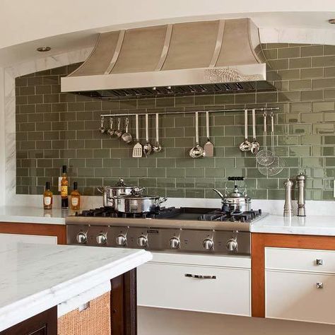 In an otherwise neutral kitchen, a wall of gray-green subway tiles adds a touch of color and shimmer. Subway tiles come in dozens of colors and are often easy on the budget, so creating a show-stopping kitchen backsplash gives you plenty of bang for your buck. Colorful Subway Tile Backsplash, Subway Tile Colors, Green Subway Tile, Green Backsplash, Subway Tile Backsplash Kitchen, Farmhouse Backsplash, Kitchen Tiles Design, Subway Tile Kitchen, Design Websites