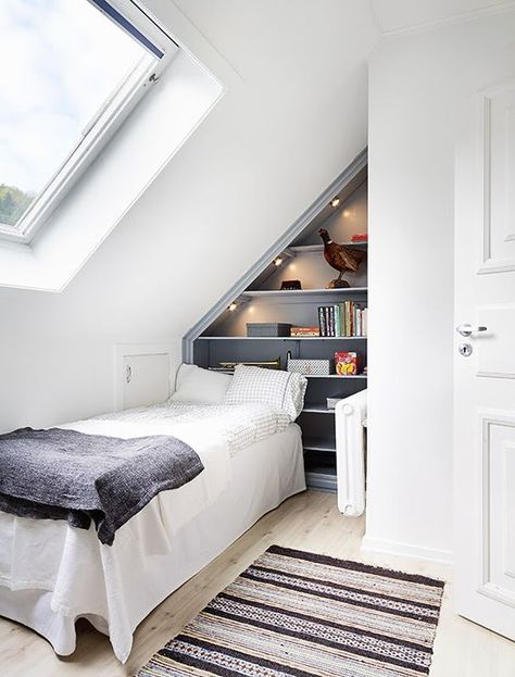 a practical small attic bedroom with a built in storage unit Small Attic Bedroom Designs, Attic Storage Ideas, Small Attic Spaces, Small Loft Bedroom, Small Loft Spaces, Small Attic Bedroom, Small Attic Room, Attic Room Ideas, Small Attic Bathroom