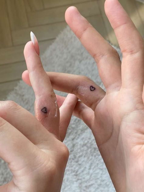 Small Matching Tattoos Aesthetic, Tattoo Ideas Female Couple, Matching Finger Heart Tattoo, Hidden Matching Tattoos, Cute Boyfriend Girlfriend Tattoos, Matching Tattoos On Finger, Bite Tattoo Couple, Finger Tattoo Matching, Matching Finger Tats