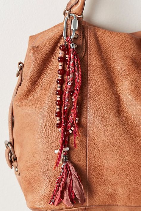 Take your bag game to the next level with this so cool charm featured in a tassel-inspired style with beading and bandana detailing for a totally timeless finishing touch. | Beaded Bandana Bag Charm at Free People in Rust Free People Bag Charms, Purses With Charms, Handbag Charms Aesthetic, Designer Bag Charms, Bead Bag Charm, Bag Chain Accessories, Purse Charms Aesthetic, Purse Accessories Ideas, Leather Bag Charm