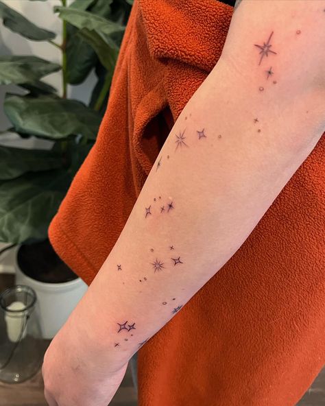 Arm Stars Tattoo, Sparkle Tattoo Forearm, Celestial Patchwork Tattoo Sleeve, Forearm Star Tattoos For Women, Sparkle Arm Tattoo, Sparkles Tattoo Design, Stars Forearm Tattoo, Four Point Star Tattoo, 5 Point Star Tattoo