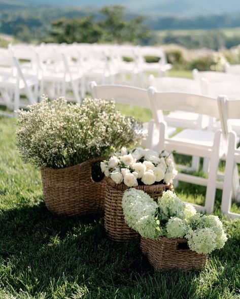 White Wedding Ceremony Chairs, Wedding Inspo Neutral, Wicker Centerpiece Wedding, Wedding Flower Basket Ideas, Aisle Design Wedding, Potted Aisle Flowers, Baskets With Flowers Wedding, Wedding Aisle White Chairs, Basket Florals Wedding