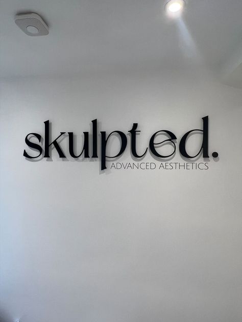 Black acrylic raised logo + black vinyl subtext made for Skulpted. Advanced Aesthetics new clinic. Med Spa Signage, Aesthetics Clinic Logo, Salon Suite Wall Decor, Aesthetic Clinic Name Ideas, Black Esthetics Room, Black Hair Salon Aesthetic, Aesthetic Clinic Logo, Black Esthetics, Aesthetic Clinic Interior