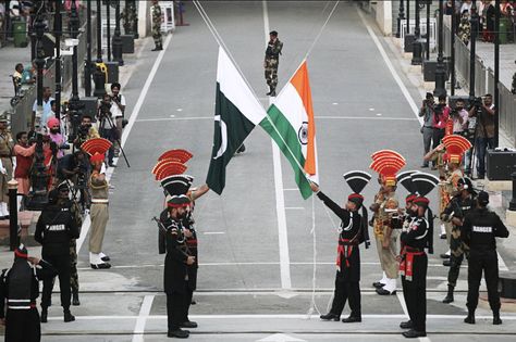 August 14, 2019 - Pakistani Rangers (wearing black uniforms) and Indian Border Security Force (BSF) officers lower their national flags during parade on the Pakistan's 72nd Independence Day, at the Pakistan-India joint check-post at Wagah border, near Lahore, Pakistan (REUTERS/Mohsin Raza) Border Security Force, Diwali Sweets, Indian Government, Bad Food, India And Pakistan, Nuclear Power, Modern History, New Delhi, Diwali