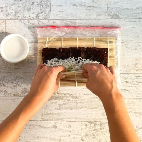 Learn how to roll sushi using our step by step photo & video guide. Instructions for through rolling sushi with or without a mat! Diy Sushi Roller Mat, How To Roll Sushi With Mat, How To Roll Sushi, Sushi Mat, Roll Sushi, Diy Sushi, How To Roll, Sushi Roll, Sushi Rice