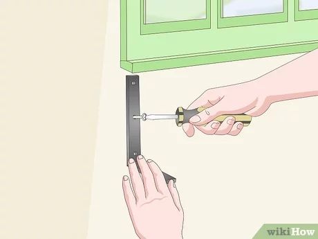 3 Ways to Hang Window Boxes - wikiHow Hanging Window Boxes, Railing Planter Boxes, Window Box Brackets, Vinyl Siding Hooks, Metal Window Boxes, Decking Screws, Railing Planters, Window Planters, Aluminum Siding