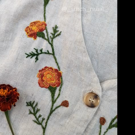 I embroidered marigold blessings on a linen dress. follow my Instagram to see more embroidery magic ✨🪡 Marigold Embroidery Design, Marigold Flower Embroidery, Embroidery Around Neckline, Marigold Embroidery Patterns, Embroidery Marigold, Indian Embroidery Designs By Hand, Embroidered Marigold, Embroidered Botanicals, What To Embroider