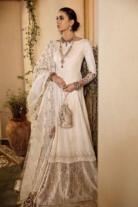 A symbol of beauty and Luxury this beautiful Ivory Peshwas by Ammara Khan Bridal Collection ‘Ronaq’ featuring Pure Silk with a Brocade Border is a perfect dress. You can also wear this dress at Nikah Ceremony pair it with beautiful Embroidered Silk Organza Dupatta. Desi Wedding Dresses, Nikkah Dress, Asian Bridal Dresses, Pakistani Wedding Outfits, Desi Style, Ghagra Choli, Pakistani Bridal Dresses, Pakistani Bridal Wear, Asian Outfits