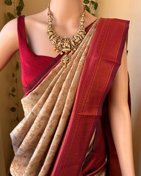 Www.thejacouture.in> silk sarees> Ivory art silk saree. Ivory art silk saree with contrast reddish maroon border. Comes with copper gold zari design all over saree and pallu with contrast blouse . Blouse : 80cm Wash care: Normal wash. Jewellery: @elegant_fashion6095 #ivorysaree #artsilk #saree #sareelove #indiantradition #silksarees #uniquecombination #instagramsarees #onlineshopping Ivory Saree With Contrast Blouse, Copper Blouse Designs, Jewellery Elegant, Golden Saree, Maroon Saree, Half Saree Lehenga, Wedding Lehenga Designs, Saree Lehenga, Tamil Wedding