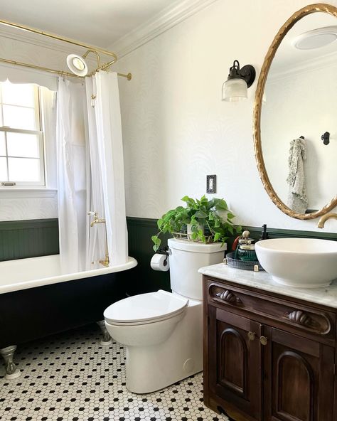 There were so many good things already going on in this bathroom, but it definitely needed a facelift! I *loved* the clawfoot tub and the vanity was so unique. We ended up replacing the diverter, doing some drywall repair, completely repainting everything from the ceiling down, adding a Bluetooth speaker fan, wallpapering, changing out the mirror and adding additional storage. I absolutely love the color palette in this space and all of the character! What do you think of the white wal... Green Clawfoot Tub Bathroom, Claw Foot Tub Shower Combo, Green Clawfoot Tub, Clawfoot Tub Shower Combo, Bathroom With Clawfoot Tub, Clawfoot Tub Bathroom, Flat Kitchen, Clawfoot Tub Shower, Drywall Repair