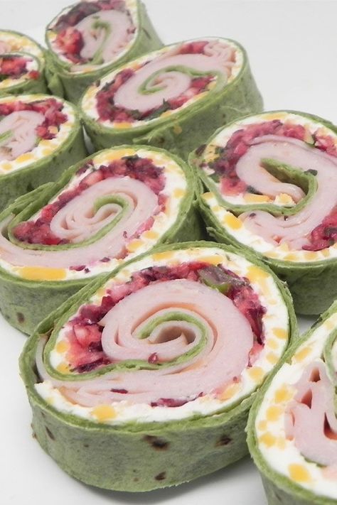 Looking for the best appetizer recipes? Try making these spicy turkey and cranberry pinwheels. Use cranberries, jalapeno peppers, cream cheese, turkey lunch meant, and spinach flour tortillas for a quick and easy appetizer, snack, finger food, Christmas food, football food, or Super Bowl party food. Turkey Cranberry Pinwheels, Cranberry Feta Pinwheels, Cranberry Pinwheels, Feta Pinwheels, Cranberry Crumble, Turkey And Cranberry, Turkey Pinwheels, Pinwheel Sandwiches, Spicy Turkey