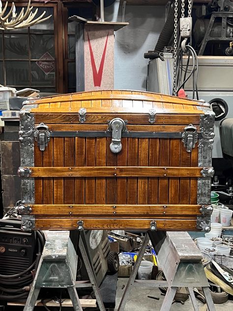 Available in Blue Caboose Station Etsy shop is an 1890's freshly refreshed Antique Oakslat trunk made in Fall River, MA. This is a large trunk that measures 35 x 20.75 x 25.5. It has five slats on the top that run horizontally, and also two each on sides and three on front and back. The handles have been replaced with nice hand-stitched super strong leather straps from a shop in Maine using original end caps.   The inside was stripped of the old paper and sanded smooth.  We added a fabric bottom Fall River Ma, Old Trunks, Antique Trunk, First Home Gifts, Fall River, Tung Oil, Vintage Storage, Blanket Storage, Old Paper