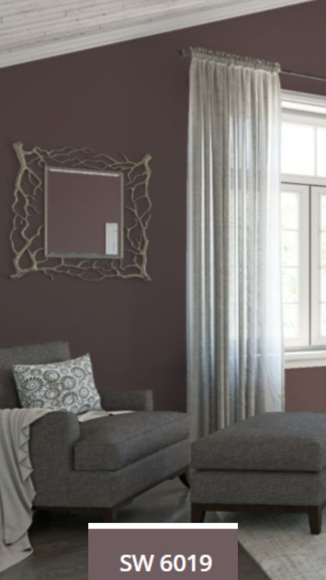 Poetry Plum wall color, a Sherwin-WIlliams Paint Color of the Year (SW-6019) painted on the bedroom walls near a comfortable chair & window. Plummy Sherwin Williams, Poetry Plum Sherwin Williams, Plum Bedroom Walls, Plum Living Room Ideas, Sherwin Williams Purple Paint Colors, Plum Wall Color, Purple Walls Living Room, Purple Paint Colors Bedroom, Poetry Plum