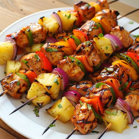 🍍✨ Taste the tropical delight of Hawaiian Chicken Kabobs! ✨🍍 #HawaiianChickenKabobs #TropicalFlavors Hawaiian Chicken Kabobs Ingredients: Chicken breasts (2, cut into cubes) Pineapple chunks (1 cup) Bell peppers (1 cup, cut into chunks) Red onion (1, cut into chunks) Soy sauce (1/4 cup) Honey (1/4 cup) Garlic (2 cloves, minced) Ginger (1 tsp, grated) Olive oil (2 tbsp) Salt and pepper (to taste) Instructions: In a bowl, mix soy sauce, honey, garlic, ginger, and olive oil. Add chicken cube... Thread Chicken, Hawaiian Chicken Kabobs, Chicken Cubes, Pineapple Chunks, Instagram Recipes, Hawaiian Chicken, Skewers Grill, Twisted Recipes, Must Have Kitchen Gadgets