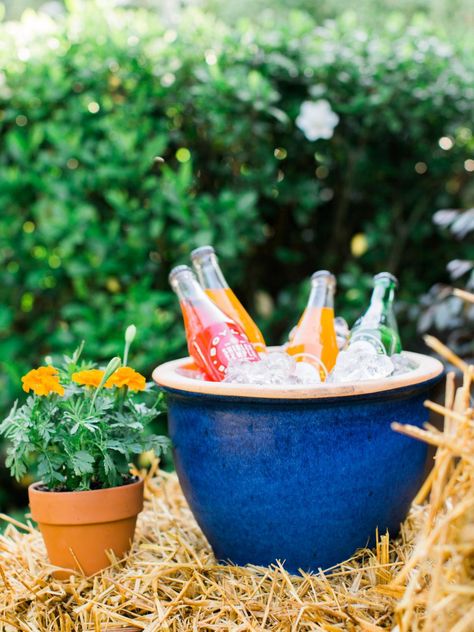 You don't need lots of serving dishes or fancy glassware to have a party — just a little creativity. Here's how to use what you already have at your next bash.  From the experts at HGTV.com. Picnic Hack, Fancy Glassware, Kid Friendly Party, Pitcher Cocktails, Watermelon Party, Patio Planters, Hay Bales, Easy Entertaining, Diy Network