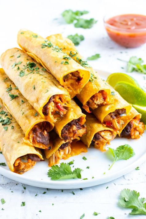 Slow Cooker Chicken Taquitos, Chicken Taquitos Baked, Chicken Taquitos Recipe, Baked Chicken Taquitos, Baked Taquitos, Refried Black Beans, Taquitos Recipe, Frijoles Refritos, Mexican Appetizers