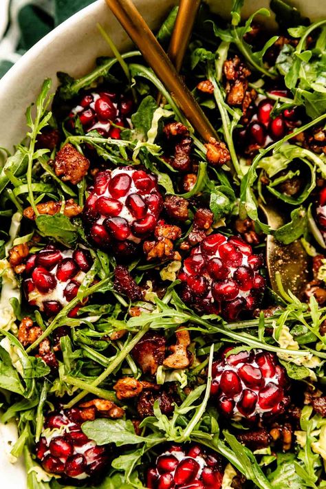 This Christmas Salad with Pomegranate Goat Cheese "Ornaments" is a holiday season showstopper! Made with shaved Brussels sprouts, arugula, candied spiced nuts, & beautiful goat cheese “ornaments” rolled in fruity pops of pomegranate, this easy side salad is texture-loaded, hearty, & savory-sweet. The perfect addition of festive freshness for any Christmas dinner table! (Make-ahead tips included!) #christmassalad #christmassaladrecipes #christmassaladideas #saladrecipes #christmasdinnerideas Pomegranate Goat Cheese, Easy Side Salad, Beautiful Goat, Salad With Pomegranate, Christmas Salad Recipes, Christmas Salad, Winter Salad Recipes, Side Salads, Holiday Salads