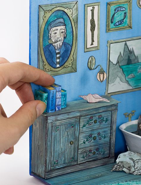 llustration, miniature 3D paper diorama. Selkie Folktale, nautical bookcase detail, gouache Diorama Illustration, Nautical Bookcase, Origami Diorama, Matchbox Diorama, Book Diorama, Diorama Paper, Paper Diorama, Paper Miniatures, Diorama Art