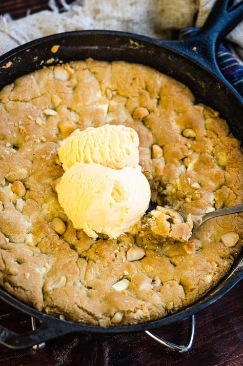 A White Chocolate Macadamia Nut Pizookie in a cast iron skillet with vanilla ice cream on top Pizookie Recipe, Skillet Cookie Recipe, Cast Iron Skillet Cooking, Feed The Hungry, White Chocolate Macadamia Nut, Bar Desserts, Macadamia Cookies, Skillet Chocolate Chip Cookie, Warm Desserts