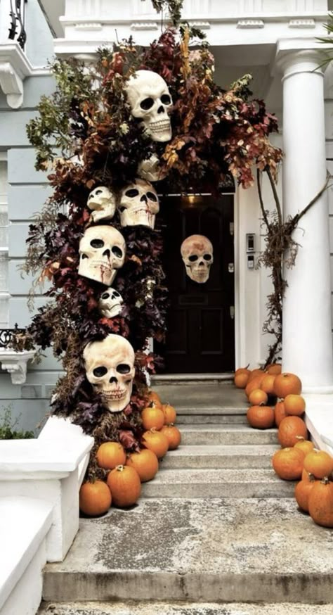 We are sharing 37 epic Halloween front porch decor ideas that you are going to want to replicate! These are all gorgeous and so fun for Fall and Halloween! Halloween Porch Stairs, Front Lawn Fall Decor Ideas, Skeleton Front Door Decor, Corporate Halloween Decor, Halloween Decorations For Stairs, Outdoor Fall Halloween Decor, Outdoor Halloween Photo Booth, Outdoor Tree Halloween Decor, Creative Halloween Decorations Outdoor