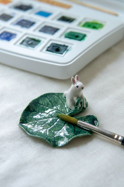 ceramic white rabbit on the leaf dish Clay Brush Rest, Aesthetics Room Decor, Coffee Mug Crafts, Clay Dish, Ceramic Brush, Brush Rest, Handmade Ceramic Jewelry, Working Desk, Incense Cone