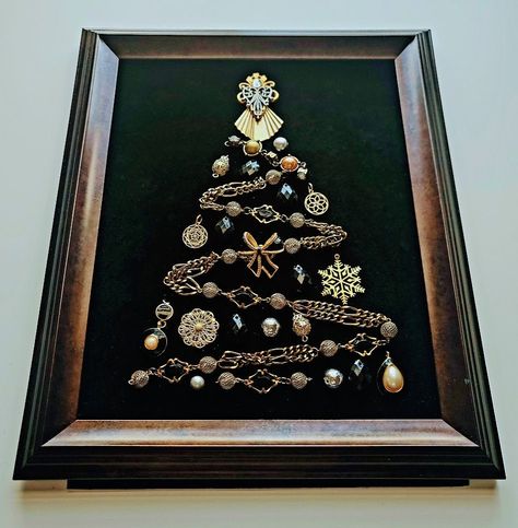 More Christmas Trees section from this shop:  https://www.etsy.com/shop/OddBeadsShoppe?section_id=45713888 Vintage Christmas Tree | Christmas tree in a frame | Christmas Tree | Christmas Tree Wall hanging | Christmas Gift What can be a better gift to yourself or your family members than a pretty vintage style Christmas Tree in a frame?  Made of beads and chains and jewelries, all carefully chosen and balanced in shapes and colors! The design is totally unique, this is a one-of-a-kind artwork, there are no exact copies of it. The elements of the Piece are attached properly and cannot be moved, replaced or detached. The piece is shipped as shown in a picture.  The vintage style frame is ready to hang on the wall or to be placed on your table on a shelf. There is no glass covering the item in A Frame Christmas, Christmas Button Crafts, Old Jewelry Crafts, Costume Jewelry Crafts, Jeweled Christmas Trees, Vintage Jewelry Ideas, Vintage Style Christmas, Jewelry Frames, Frame Christmas