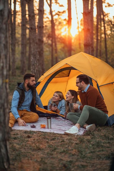 Four young friends sitting outside their tent drinking hot beverages and socializing, look at the happiness of their face | camping photography Camping Photography Friends, Camping Photoshoot, Photoshoot Friends, Sitting Outside, Camping Photography, Hot Beverages, Friend Photoshoot, Styled Shoot, Outdoor Bed