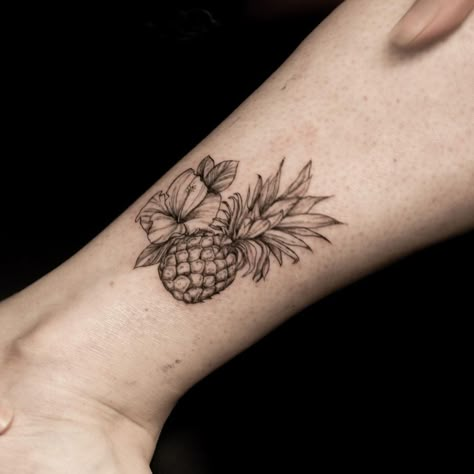 Tropical Flower And Pineapple Tattoo. A heavily shaded pineapple and flower combination inked with thick lines. Click through for 25 pineapple tattoo ideas. #pineappletattoo #tattooideas #tattoo IG: @simwerks Hawaiian Theme Sleeve Tattoo, Pineapple And Hibiscus Tattoo, Pineapple And Palm Tree Tattoo, Pineapple And Flower Tattoo, Pineapple Finger Tattoo, Pineapple Flower Tattoo, Pineapple With Flowers Tattoo, Hawaiian Pineapple Tattoo, Dainty Pineapple Tattoo