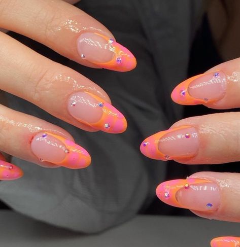 orange and pink nails | french tip nails | gem | rhinestones | sunset nails | peach nails | acrylic | gel | nail art | oval shape | almond shape Sunset French Nails, Gem Almond Nails, Pink Nails French Tip, Orange And Pink Nails, Pink Nails French, Orange French Tip, Fall Almond Nails, Sunset Nails, Nails French Tip