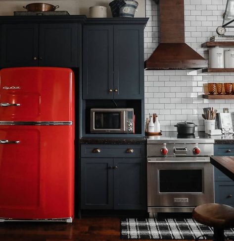 A warm bowl of soup in this cozy kitchen sounds perfect on this fall Saturday! 🍂 ​Design + Photo by @sentimentalsoulphotography. ​Build by @juergenspropertydevelopment. #kitchendesign #kitchen #kitchentile Navy And Green Kitchen, Red Fridge Kitchen, Colorful Boho Kitchen, Fall Saturday, Red Fridge, Colorful Kitchen Ideas, Navy Cabinets, Modern Kitchen Backsplash, Kitchen Vignettes