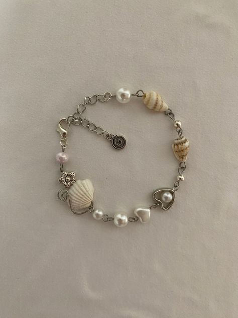 dawningofopulence on instagram Bracelet Ideas To Sell, Sea Bracelet, Beaded Charm Bracelet, Charm Bracelet Ideas, Ocean-inspired Summer Jewelry With Pearl Charm, Coquette Handmade Jewelry, Adjustable Ocean-inspired Jewelry With Pearl Charm, Mermaidcore Bracelet, Ocean-inspired Shell Bracelet Jewelry