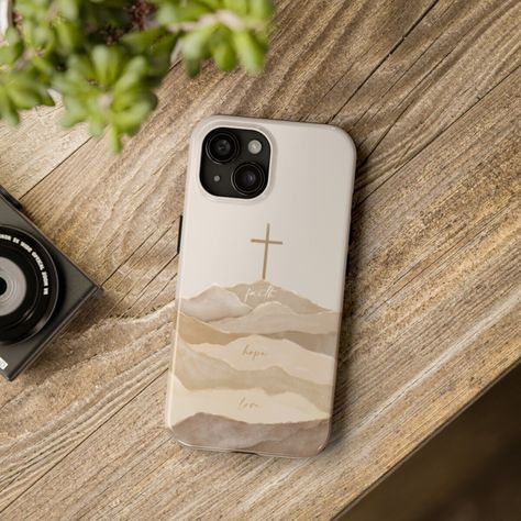 A B O U T  A R T W O R K ✎ Biblical modern and boho watercolor art of the Cross with the words: Faith, Hope, Love ----------------------------------------------------------------------------- P R O D U C T  D E T A I L S ♥ Protect your phone in a Christian-themed tough phone case. This lightweight phone case is impact resistant and comes with the perfect surface to print all your ideas in vivid detail as well as crisp color. Compatible with iPhone 7, 8, X, 11, 12, 13, 14 & more - check our avail Country Phone Cases, Christian Iphone Cases, Christian Baptism, Boho Watercolor, Cross Christian, Christian Bible Quotes, Iphone Hard Case, Baptism Gifts, Faith Hope Love