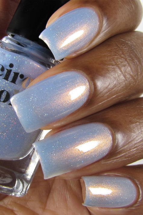 Hygge (pronounced HOO-GAH which means "cozy" in Danish) is a sheer light blue nail polish with strong copper shimmer and delicate holographic sparkle. Our shimmer polishes are packed with glimmering pigments which give them a unique multidimensional. Ice Nails, Holographic Nail Designs, Light Blue Nail, Light Blue Nail Polish, Blue Chrome Nails, Blue Glitter Nails, Light Blue Nails, Baby Blue Nails, Cirque Colors