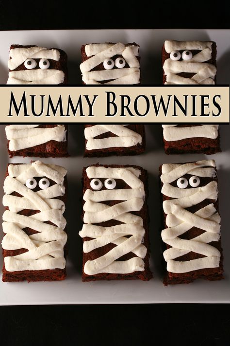 Rectangular brownies on a plate with horizontal strips of white frosting.  Candy eyes near the top, the brownies resemble a cartoonish mummy.  Text overlay says Mummy Brownies. Party Brownies, Mummy Brownies, Confectioners Sugar Icing, Holiday Brownies, The Best Brownies, Ultimate Brownies, Halloween Brownies, Candy Eyes, Dairy Free Brownies