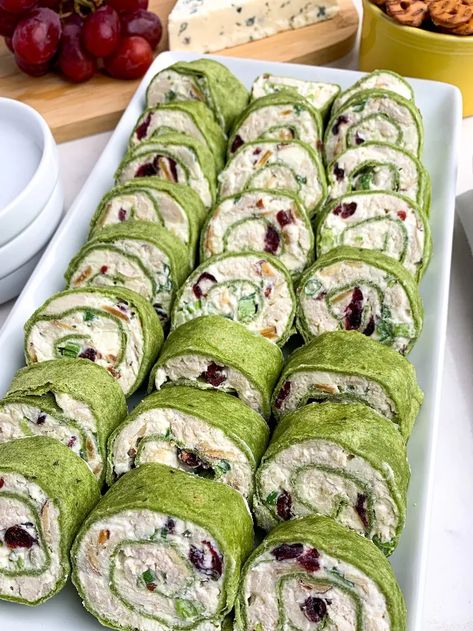 are filled with chicken, almonds, cranberries, green onions, and feta, rolled up in spinach tortillas. A great appetizer for parties -- and they taste even better than they look. As an Amazon Associate I earn from qualifying purchases. You’re going to love these This is such an easy recipe to make for game days or during the holiday season. And you'll be the hit of the party because everyone loves these tortilla roll-ups! Perfect finger food. Bring these tortilla pinwheel ap… Tortilla Pinwheel Appetizers, Chicken Cranberry Salad, Pinwheel Sandwich Recipes, Tortilla Pinwheels Recipe, Spinach Tortillas, Chicken Cranberry, St Patricks Food, Chicken Pinwheels, Cream Cheese Pinwheels