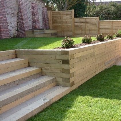 Garden Sleepers - What's the Difference? | Suregreen Ltd Small Garden Design Low Maintenance, Railway Sleepers Garden, Sleepers In Garden, Shelter Ideas, Garden Retaining Wall, Sloped Backyard, Landscaping Retaining Walls, Garden Stairs, Tiered Garden