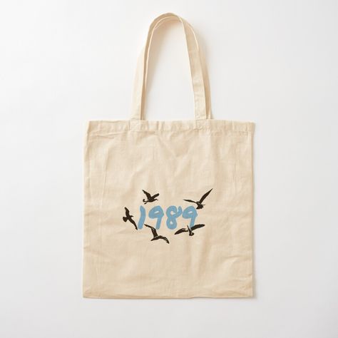 Get my art printed on awesome products. Support me at Redbubble #RBandME: https://www.redbubble.com/i/tote-bag/Taylor-Swift-1989-Taylor-s-Version-by-NaomiesCorner/150250165.P1QBH?asc=u Handpainted Tote, Handpainted Tote Bags, Acrylic Painting Ideas, Taylor Swift 1989, Print Tote, Printed Tote Bags, Tote Bag Design, Painting Ideas, Dad Hats